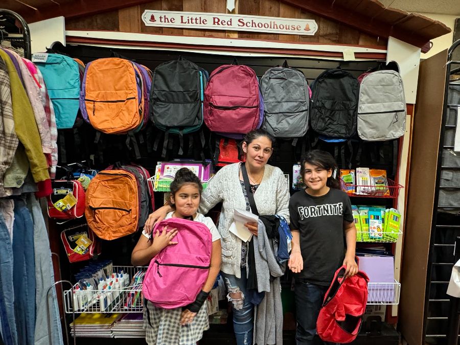 mom with children shopping for school supplies