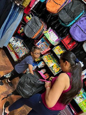 mother and child inspecting a backpack